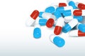 red-blue capsules are scattered on the table in the corner.